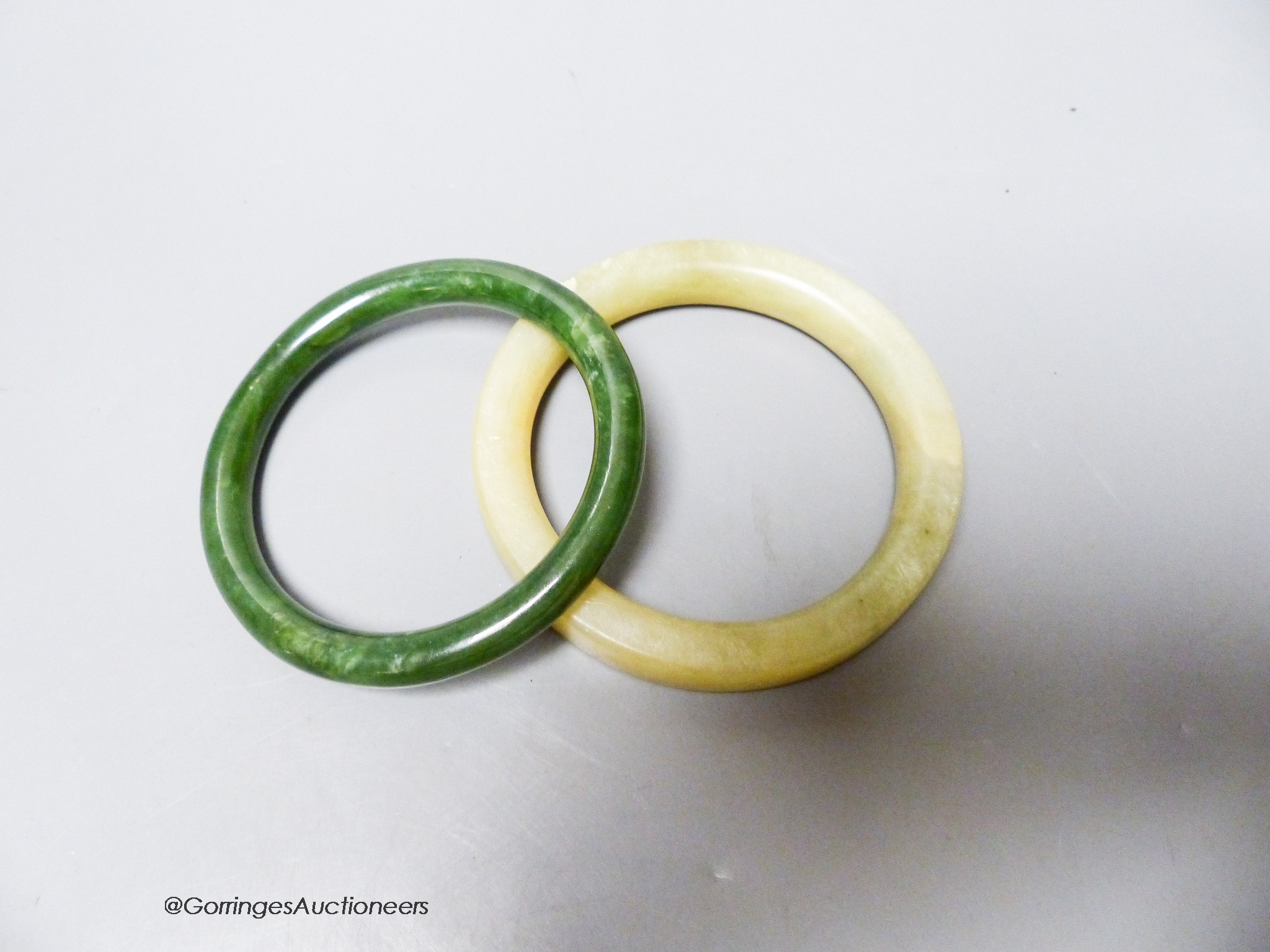 Two hardstone bangles.